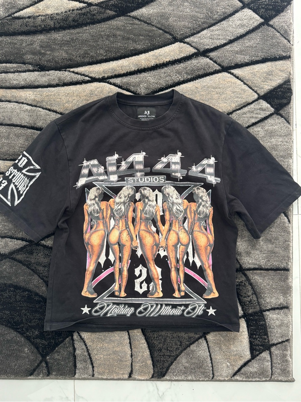 Essentials Black Short Sleeve Graphic Tee with Orange & White Print